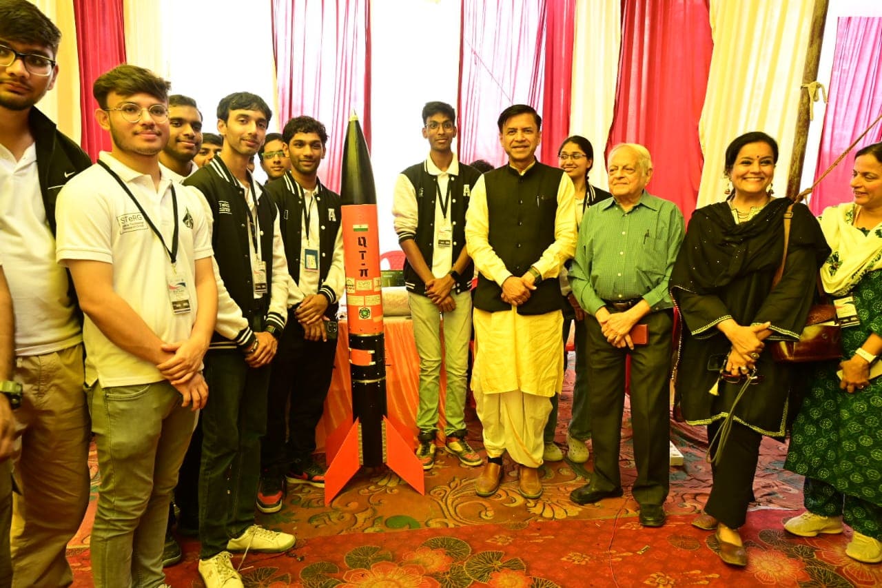 Students showcasing rocket models at SSDF event